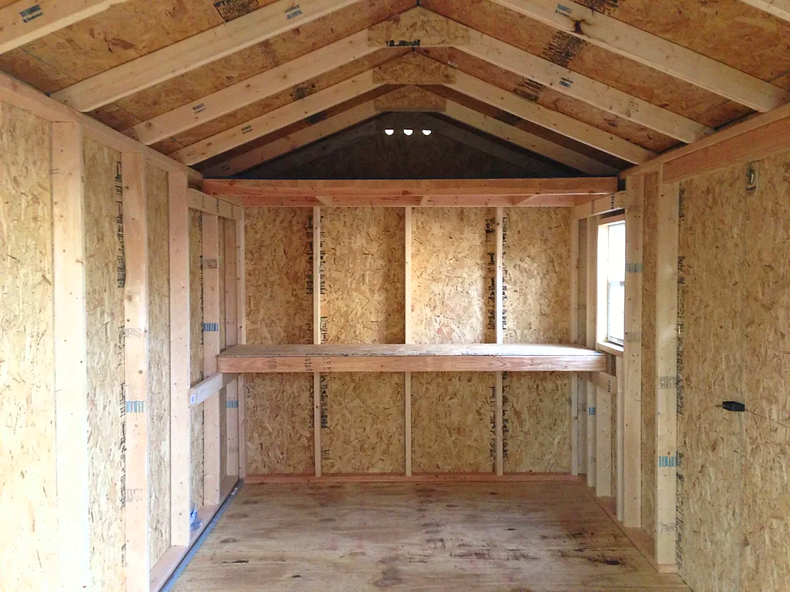 Custom built shed with workbench.